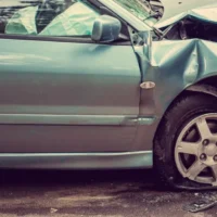 How Should Drivers Handle a Car Accident Caused by Road Debris?